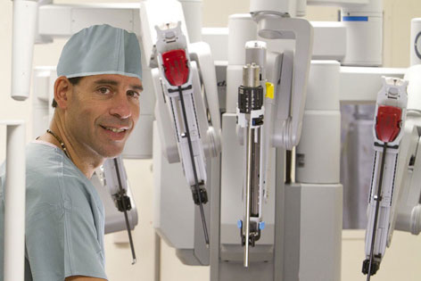 Gynecologic oncologist Dr. Robert E. Bristow performs robot-assisted and other minimally invasive procedures.